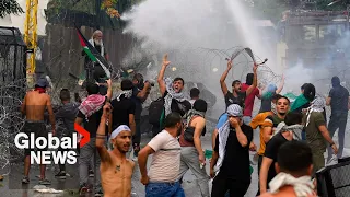 "America is the devil": Protesters near US embassy in Beirut hit with water cannon, tear gas