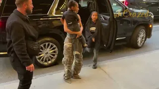 North West looks tired as Kim Kardashian walks into her hotel in New York