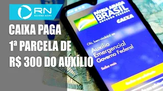 Caixa paga 1ª parcela de R$ 300 do auxílio a beneficiários do Bolsa Família