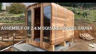 Assembly of 2.4 m square cedar barrel sauna with firewood heater