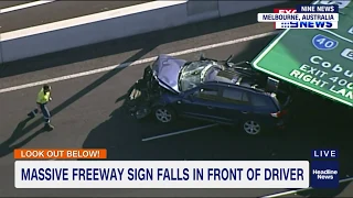 Large freeway sign falls onto moving vehicle in Melbourne, Australia