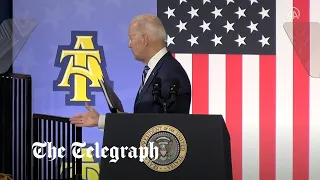 Moment Joe Biden shakes hands with thin air after speech