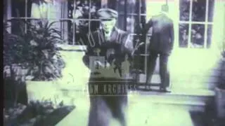 John D Rockefeller leaves house.  Film 91068