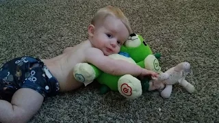 Baby Max chases the Roomba