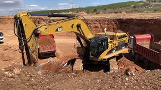 Caterpillar 365C Excavator Loading Trucks