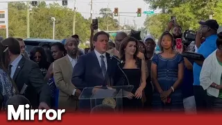 Florida governor Ron DeSantis booed at vigil as hundreds mourn racist killings