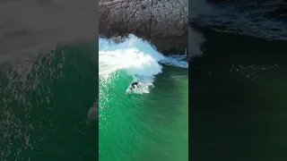 Praia do Zavial in the Algarve, Portugal - Surfers enjoying the waves.