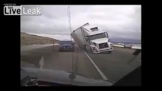 Strong Wind Blows Truck Onto Cop Car