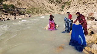 House Cleaning and Washing Blankets in the River: Nomads of Iran