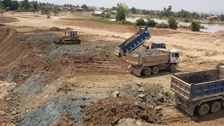 A big project to pour soil into the pond to remove the soil by term truck with bulldozer D60P