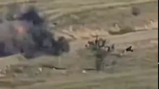 Armenian forces destroy an Azerbaijani Sandcat armored vehicle with an anti-tank guide missile.