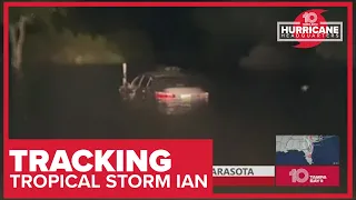 Car submerged on flooded road in Sarasota after Hurricane Ian