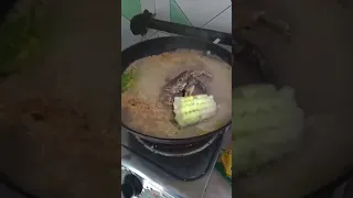 Crab eating corn in hotpot