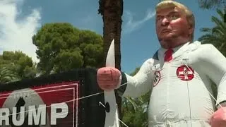 Inflatable of Donald Trump in KKK robe pops up at rally