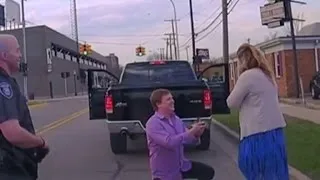 Police Officers Help a Man with Surprise Roadside Proposal