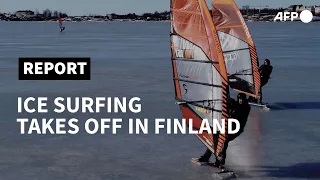 Ice surfers carve up Finland's frozen sea | AFP