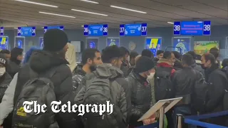 Migrants queue at Minsk airport to leave Belarus voluntarily