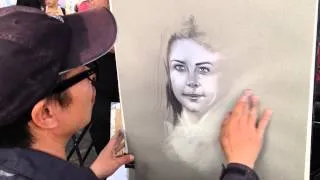 Dalia getting her portrait done in Paris