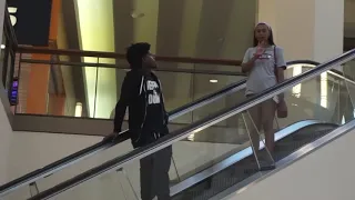 Staring at strangers on escalator prank