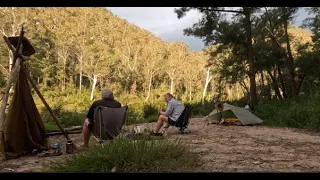 An Englishman and an Australian camp by a river