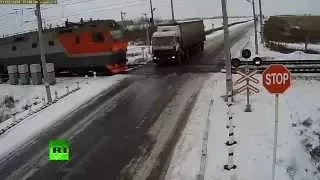 Truck torn apart by two trains at rail crossing in Kazakhstan