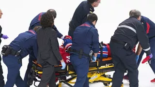 Montreal Canad iens Phillip Danault taken off ice on stretcher after being hit in head with