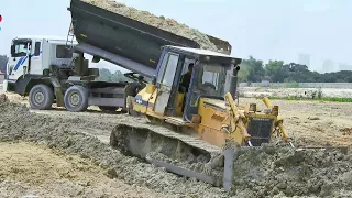 Great work! Two KOMATSU Bulldozers  skilled smooth Pushing Gravel soil & Dump trucks unloading dirt