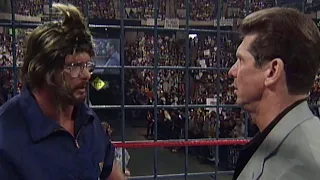 "Stone Cold" Steve Austin disguises himself as a cameraman to launch a sneak attack on Mr. McMahon