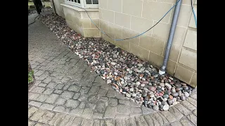 Protecting Foundation with a River Rock Channel Drain Bed