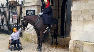 Beautiful rare moment Kings Guard lets Kid stroke horse during changing of the guard.