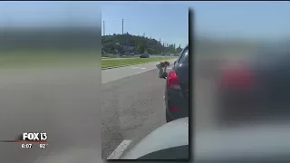 Woman beats another driver in middle of Florida roadway