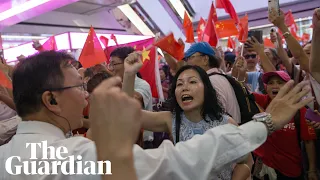 Pro-democracy protesters clash with Beijing supporters after standoff in Hong Kong mall