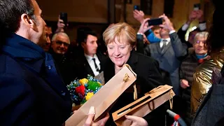 Macron piles on the praise during Merkel's farewell visit to France