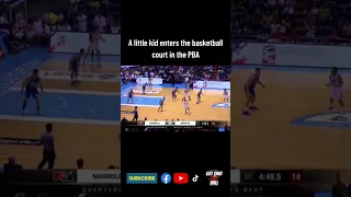 A little kid entered the basketball court in the Philippines during a live ball possession