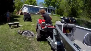 Honda ATVs pulling out a big boat