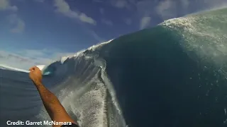 11 year old boy completes an impressive maneuver in the wave pool.