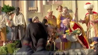 Topless woman tries to steal Baby Jesus from Nativity