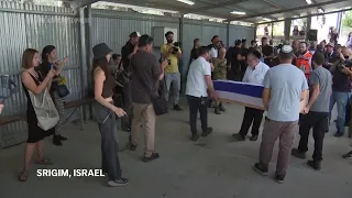 Father speaks at funeral held in Israel for Shani Louk, German-Israeli hostage killed by Hamas