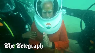 India's Modi prays underwater at 'lost city's ancient Hindu temple'