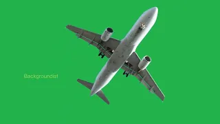 A large white plane on a green background