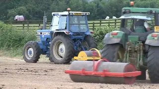 FORD 7710 II AND GRAYS FLAT ROLL, JOHN DEERE 6610 AND FLAT ROLL