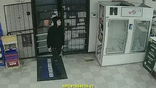 Surveillance video: Robbery suspect threatens cashier with gun, demands money
