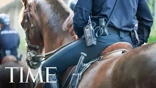 Viral Photo Shows TX Police Officers On Horseback Leading Handcuffed Man By Rope | TIME