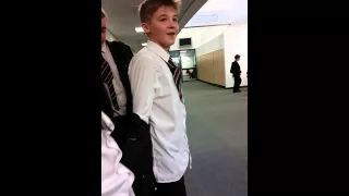 Kid does backflip in school hallway