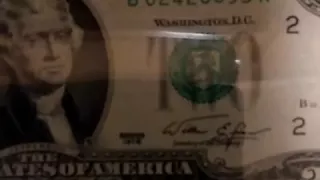 $2 bills error with green and black shield off center