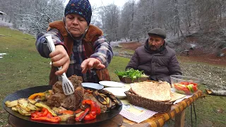 T-bone Steak with Vegetables Cooking on the Sadj