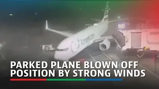 Parked plane blown off position by strong winds at Texas airport