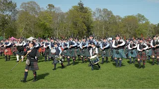 Massed Pipe Bands march off playing Scotland the Brave after 2022 North of Scotland Championship