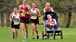 14-year-old cross country runner pushes her big brother in a wheelchair so they can compete together