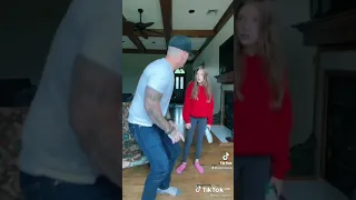the little girl slaps her father in his head